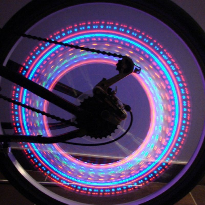 Bouchon de valve vélo lumineux LED rose avec animations